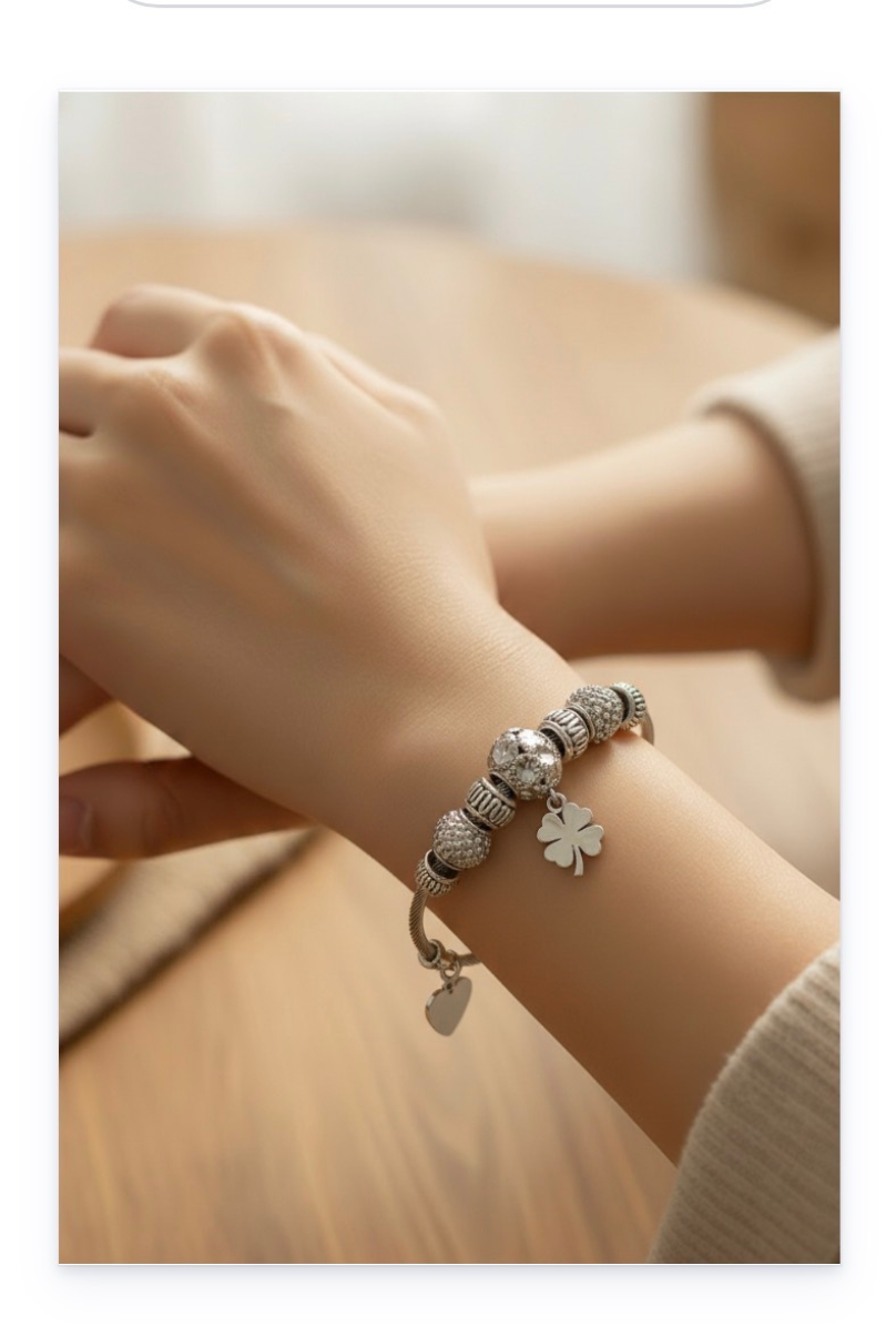 Stainless steel bracelet with dangling charms