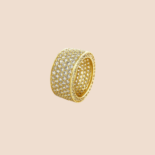 Ring in a band shape decorated with zircons, gold plated over copper base