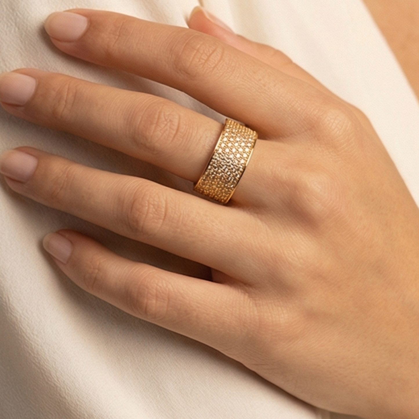 Ring in a band shape decorated with zircons, gold plated over copper base