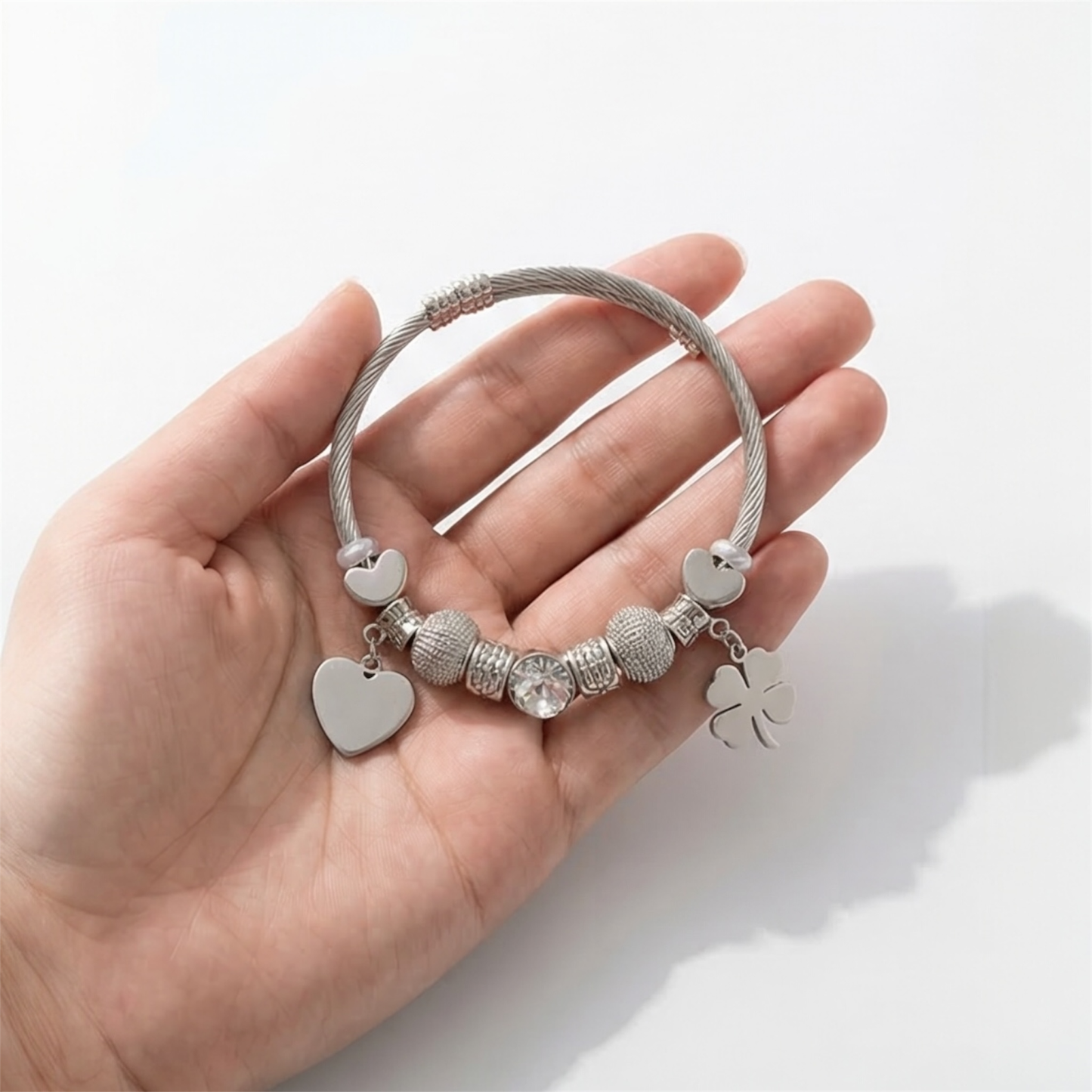 Stainless steel bracelet with dangling charms