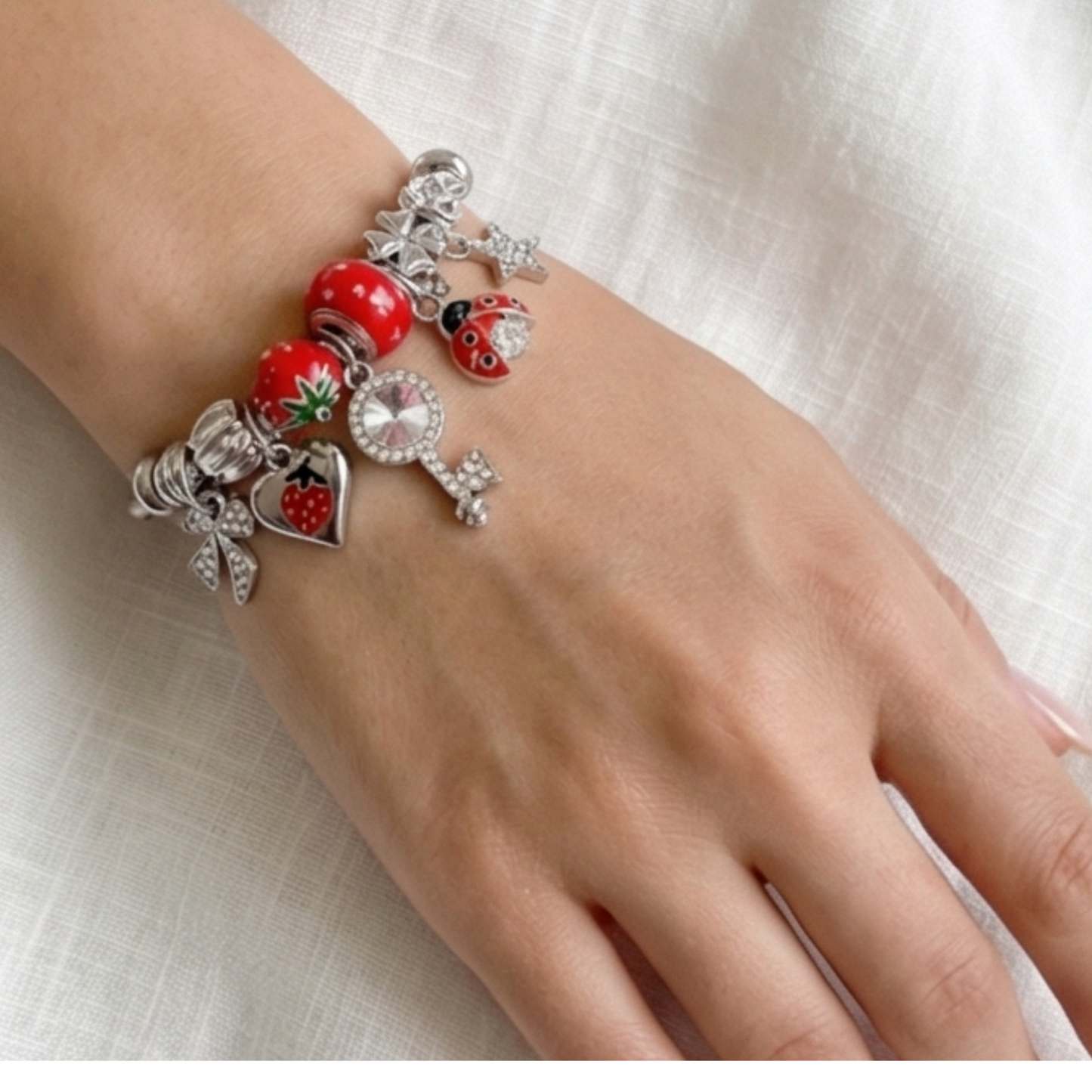 Stainless steel bracelet with dangling charms