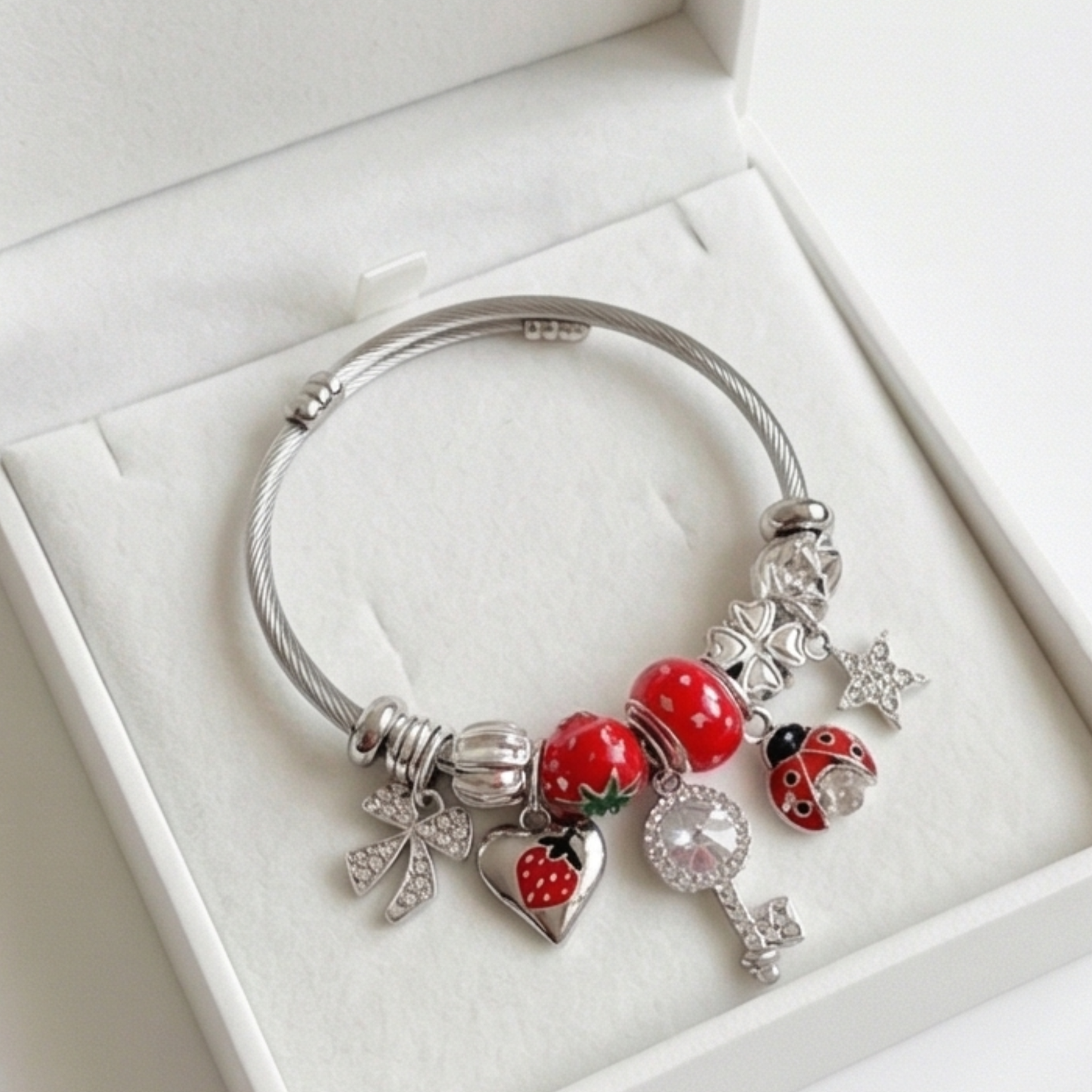 Stainless steel bracelet with dangling charms